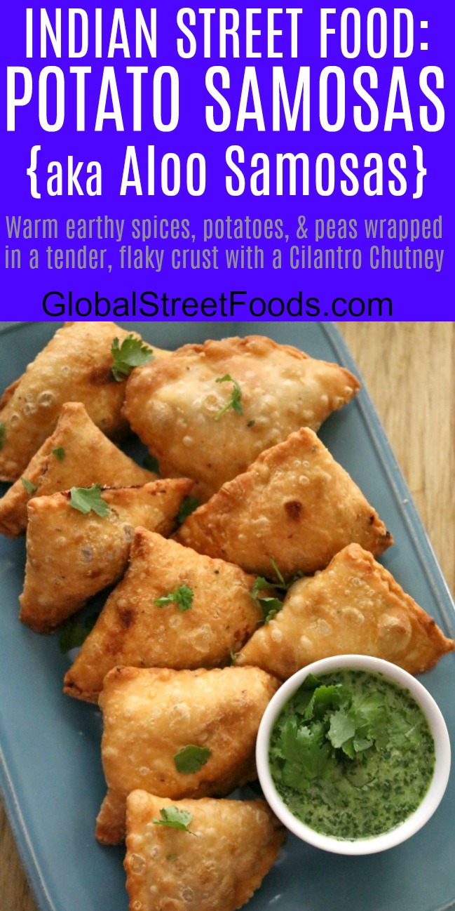 A pinnable image of Indian street food - potato samosa aloo samosa on a serving tray with cilantro chutney