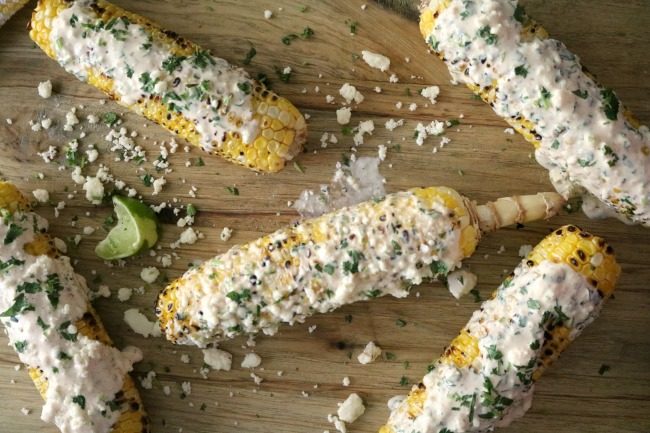 An overheard photo of Elote, Mexican Street corn, covered in cheese, cilantro and creama sauce.